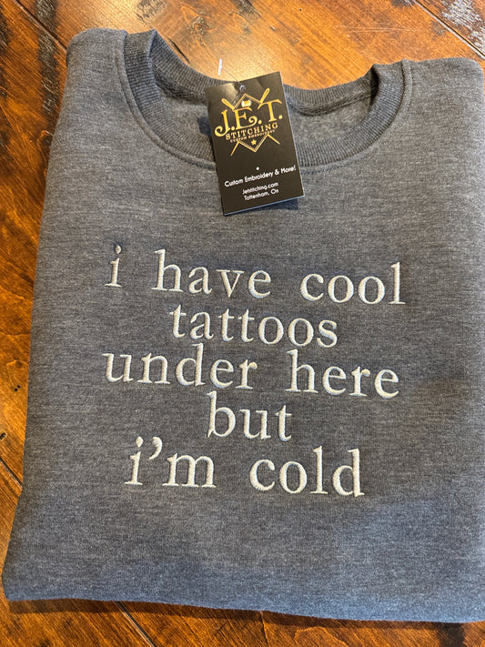 I have cool tattoos under here sweater