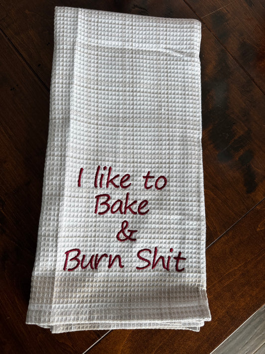 I like to bake and burn shit tea towel